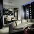 Hard Rock Hotel & Casino Biloxi suite with curved sofa, bar seating, and bold floral wall art