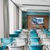 Best Western Plus Tigullio Royal Hotel Rapallo meeting room with rows of turquoise and white chairs