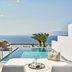 Myconian Korali Relais & Chateaux in Mykonos: private infinity pool with sea view and lounge chairs