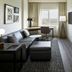 Residence Inn by Marriott Montreal Airport suite with sofa, desk, TV and bedroom in Montreal