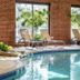 DoubleTree by Hilton Leominster indoor pool with lounge chairs and brick walls in Leominster