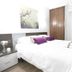 CH La Bañezana Madrid guest room with double bed, desk, wardrobe and wall art