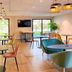 ibis Styles Rennes Cesson lounge with tables, chairs and large windows in Cesson-Sévigné