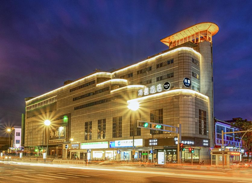 Pace Hotel Suzhou Renmin Road in Suzhou, lit exterior at night on a city street