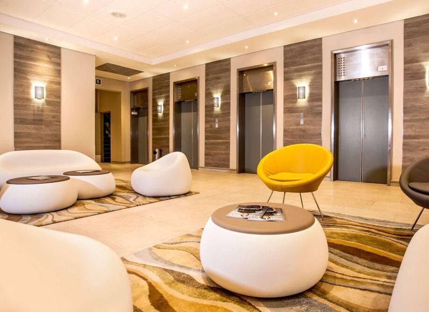 Garden Court South Beach in Durban lobby seating area with elevators and modern lounge chairs