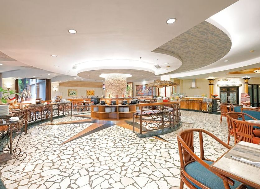 Sunlake Waterfront Resort & Convention in Jakarta lobby with mosaic floor, circular ceiling details and seating