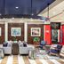Sheraton Lincoln Harbor Hotel lobby seating area in Weehawken with modern lounge chairs and artwork