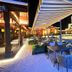 Xiang Ming Luxury Airport Hotel in Huangshan, outdoor terrace dining by the water at night