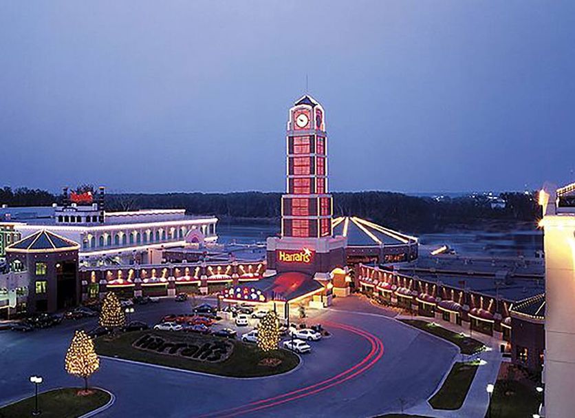 Harrah's Kansas City, A Caesars Destination in Kansas City with illuminated tower and entrance at dusk