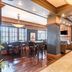 Hotel Bothwell Sedalia Central District, an Ascend Collection Hotel lobby bar with wood bar seating and lounge area in Sedalia