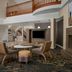 Residence Inn by Marriott Santa Clarita Valencia lobby with fireplace, seating area, and balcony railing
