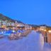 Samira Resort Hotel Aparts & Villas in Kalkan with outdoor pool, sun loungers and mountain backdrop