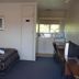 Midtown Motor Inn Whanganui room with two beds, kitchenette, desk and window