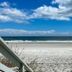 Seahorse Oceanfront Inn in Neptune Beach with oceanfront beach view and blue sky