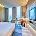 Aloft Seoul Gangnam guest room with city view, king bed, desk, and wall-mounted TV