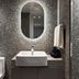 Kensington Resort Jeju Jungmun bathroom with vessel sink, oval mirror and walk-in shower in Seogwipo