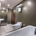 Aston Imperial Bekasi Hotel & Conference Center bathroom with bathtub, toilet, sink and shower in Bekasi