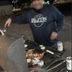 Motel 6 Sallisaw outdoor grill with people cooking at night