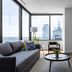Mint House Dallas Downtown By Kasa suite with city skyline views, floor-to-ceiling windows and modern seating
