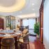 Haili Garden Hotel Guangzhou private dining room with round table set for a meal and polished wood floor