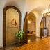 Centara Mirage Resort Mui Ne lobby in Phan Thiet with arched entryways, reception desk and chandelier