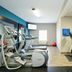 Hampton Inn Garden City fitness room with treadmills, elliptical machines and a stationary bike