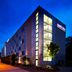 Park Inn by Radisson Frankfurt Airport exterior at night in Frankfurt am Main with lit corner windows