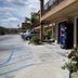 Vagabond Inn Hacienda Heights exterior walkway with parking spaces and vending machine