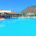 Zorbas Beach Village Hotel in Stavros with a large outdoor pool and mountain backdrop