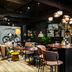 Original Sokos Hotel Arina in Oulu: stylish lounge bar with round tables, pink chairs and pendant lights