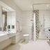 Premier Inn Aberdeen City Centre bathroom with walk-in shower, tub, toilet and vanity