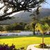 Hotel Del Pescador in Ajijic with mountain views and a landscaped lawn