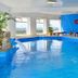 Aikendor Hotel Panoramico indoor pool with lounge chairs and panoramic El Calafate views