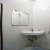 OYO 2494 Hotel Shree Plaza Bharuch bathroom with wall mirror, sink and shower fixture