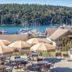 Worldmark Deer Harbor patio with tables, umbrellas and marina and water view in Deer Harbor