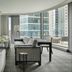 Four Seasons Hotel One Dalton Street, Boston suite with fireplace, city-view windows and seating area