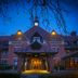 DoubleTree by Hilton Stratford upon Avon entrance at dusk with lit clock tower and covered drive