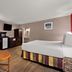 Quality Inn Wayne - Fairfield Area guest room with king bed, desk, TV and mirrored closet in Wayne