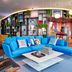 citizenM Miami World Center lobby with blue sectional, shark chair, and colorful wall art in Miami