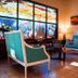 CC Beach Front Hotel in Playa Hermosa lobby with stained glass window and turquoise seating