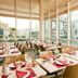 Séjours & Affaires Paris-Vitry dining room with set tables and large windows in Vitry-sur-Seine