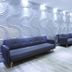 Lobby seating area at Hotel Plöner See by Tulip Inn in Plön with tufted sofas and silver wall panels