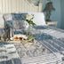 The Langworthy Inn & Winery in Westerly: bed with patchwork quilt, breakfast tray and vase of flowers