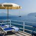 Grand Hotel Europa Palace in Sorrento: sea-view terrace with lounge chairs, umbrella and sailboat