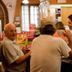 Hotel Ristorante Molino D'era in Volterra bar scene with guests chatting at the counter