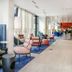 Crowne Plaza Nice - Grand Arenas lobby with lounge seating and blue carpet in Nice