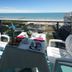Hotel Europa in Jesolo balcony breakfast with sea view and beach chairs overlooking the ocean