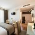 Guest room at Unahotels Eco Hotel Villa Costanza Venezia in Venice with a double bed, TV, and seating area