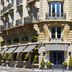 Le Dokhan's, Paris Arc de Tiromphe, a Tribute Portfolio Hotel exterior with striped awnings and corner balconies in Paris