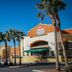 Fiesta Rancho Hotel And Casino in Las Vegas exterior with palm trees and a sunny street view